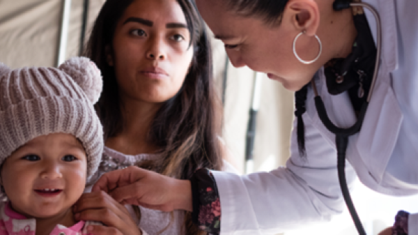 Image of mother and child with female doctor