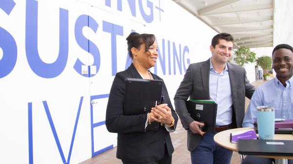 Image of employees gathered together