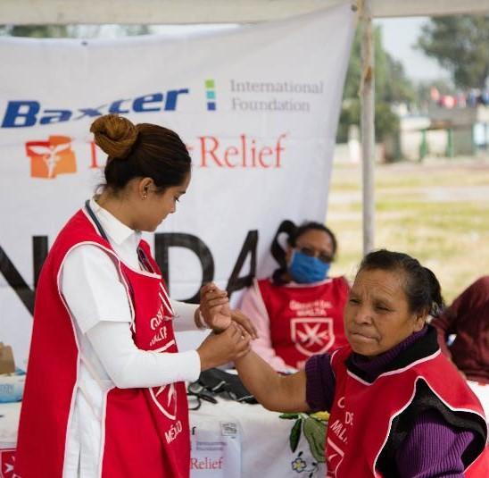 Volunteer Aid assisting at a health clinic